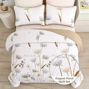 Floral-patterned comforter set on a bed with matching pillows in a bedroom setting.