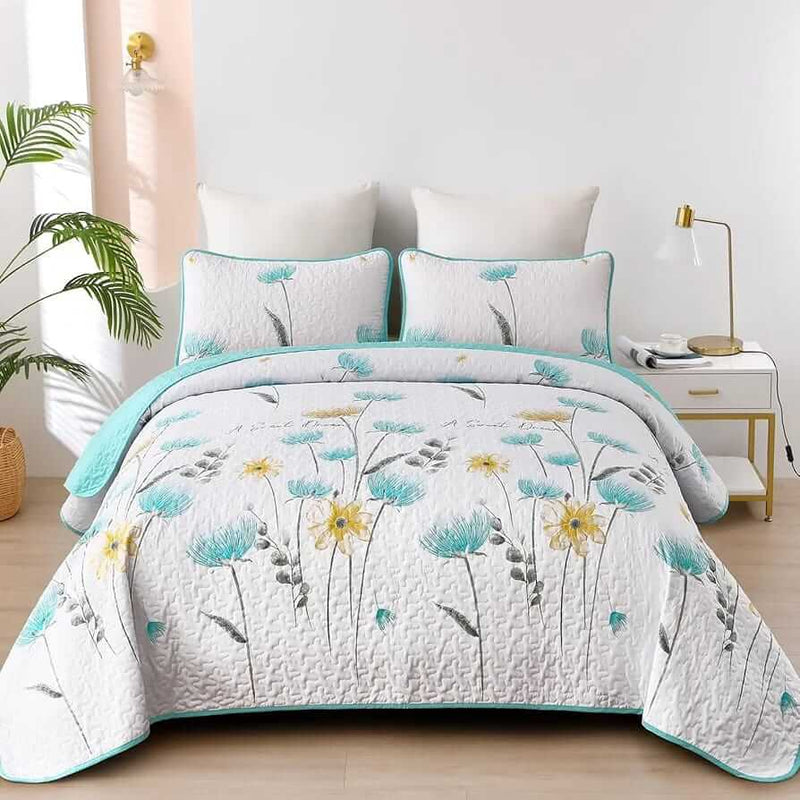 Floral patterned comforter set on a bed in a bedroom setting