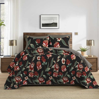 Floral patterned comforter set on a bed in a bedroom with lamps and decor.