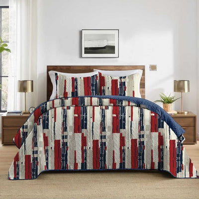 Bed with a colorful geometric patterned comforter in a bedroom setting.