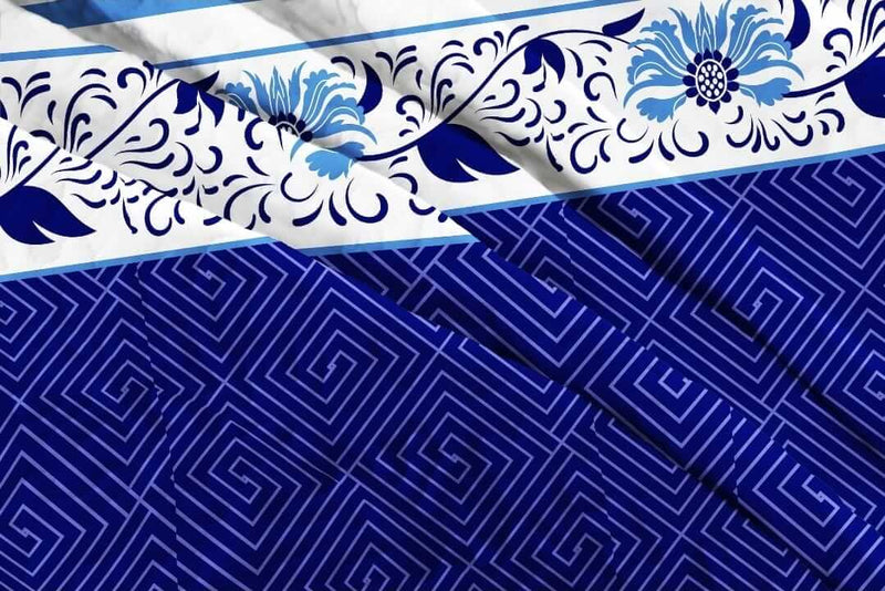Blue and white patterned fabric with floral and geometric designs.