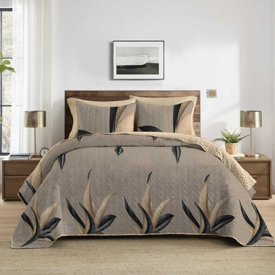 Bedding set with leaf pattern in a bedroom setting