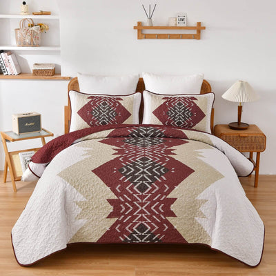 Patchwork quilt set on a bed in a bedroom with a wooden headboard.