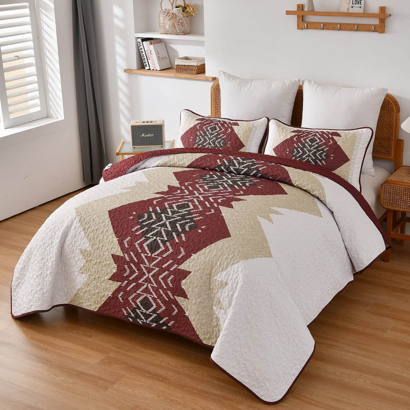 Patchwork quilt set on a bed in a bedroom with a wooden headboard.