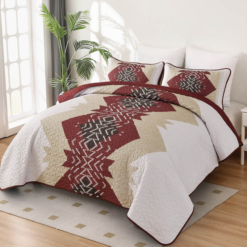 Patchwork quilt set on a bed in a bedroom with a wooden headboard.