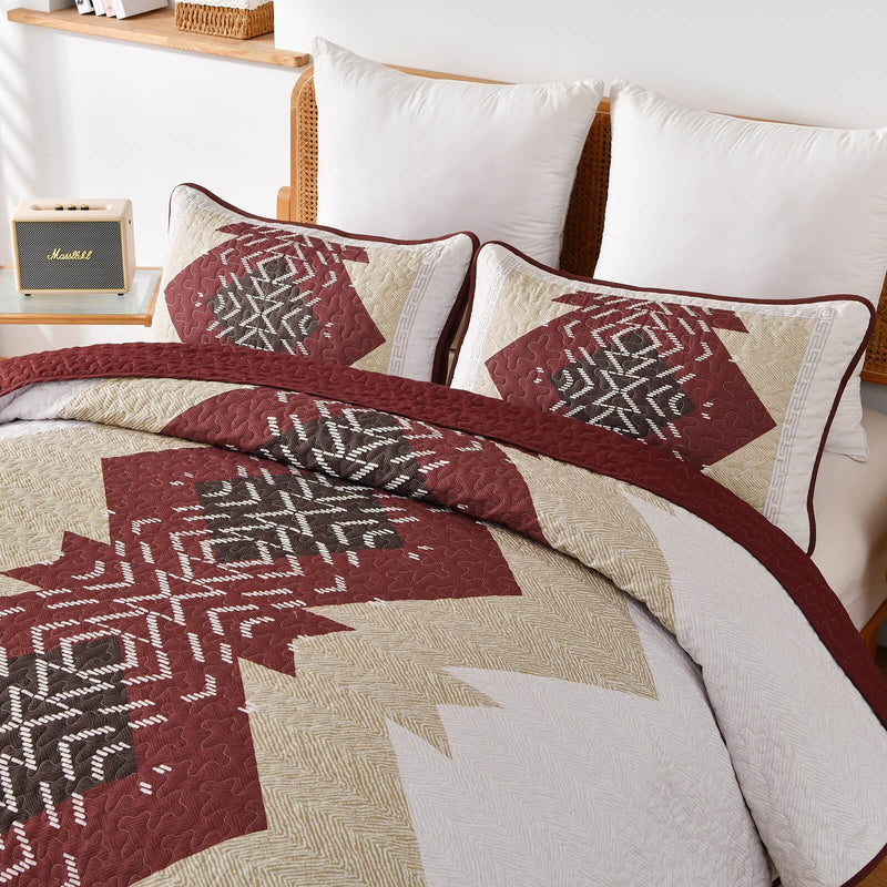 Patchwork quilt set on a bed in a bedroom with a wooden headboard.