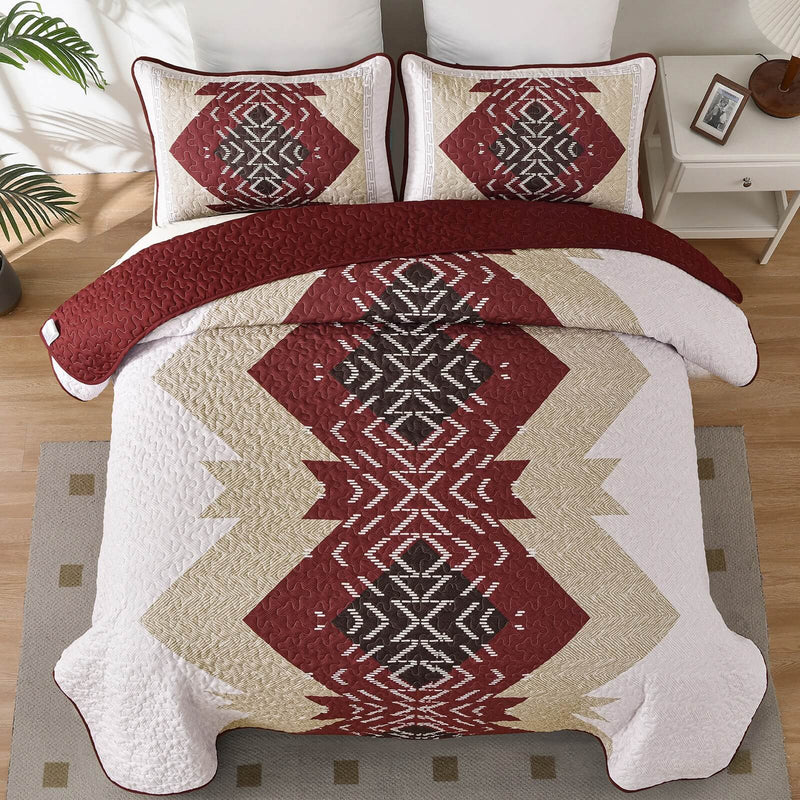 Patchwork quilt set on a bed in a bedroom with a wooden headboard.