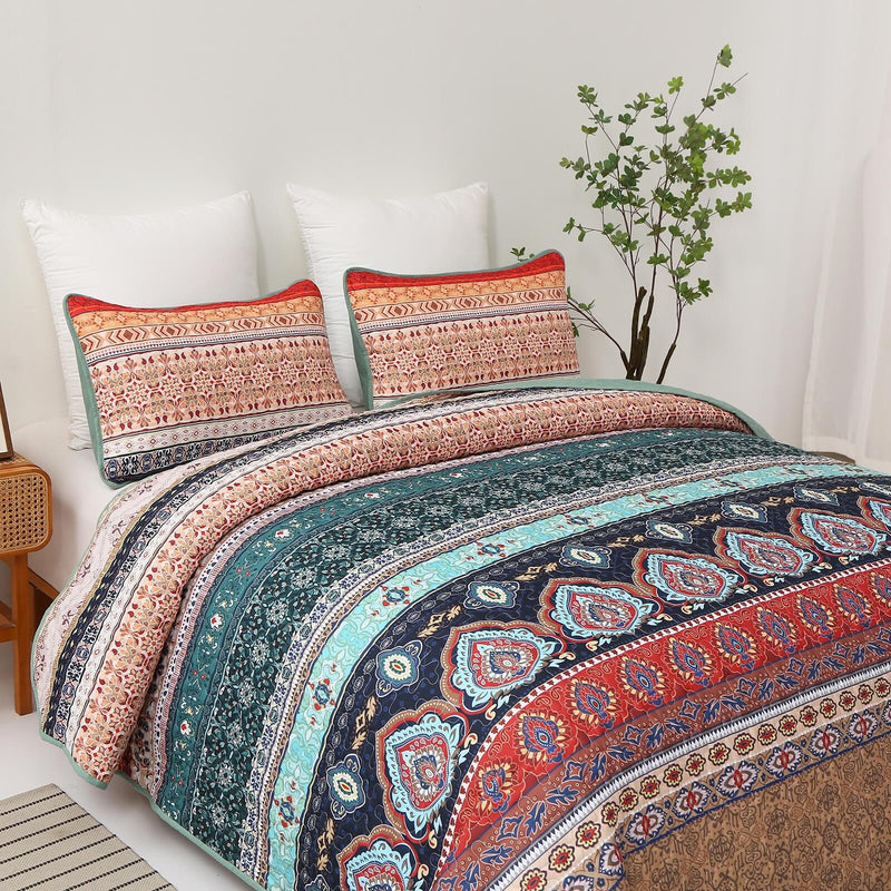 Floral patterned comforter set on a bed in a bedroom setting