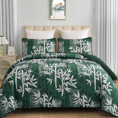Bed with a colorful quilt and pillows in a bedroom setting.
