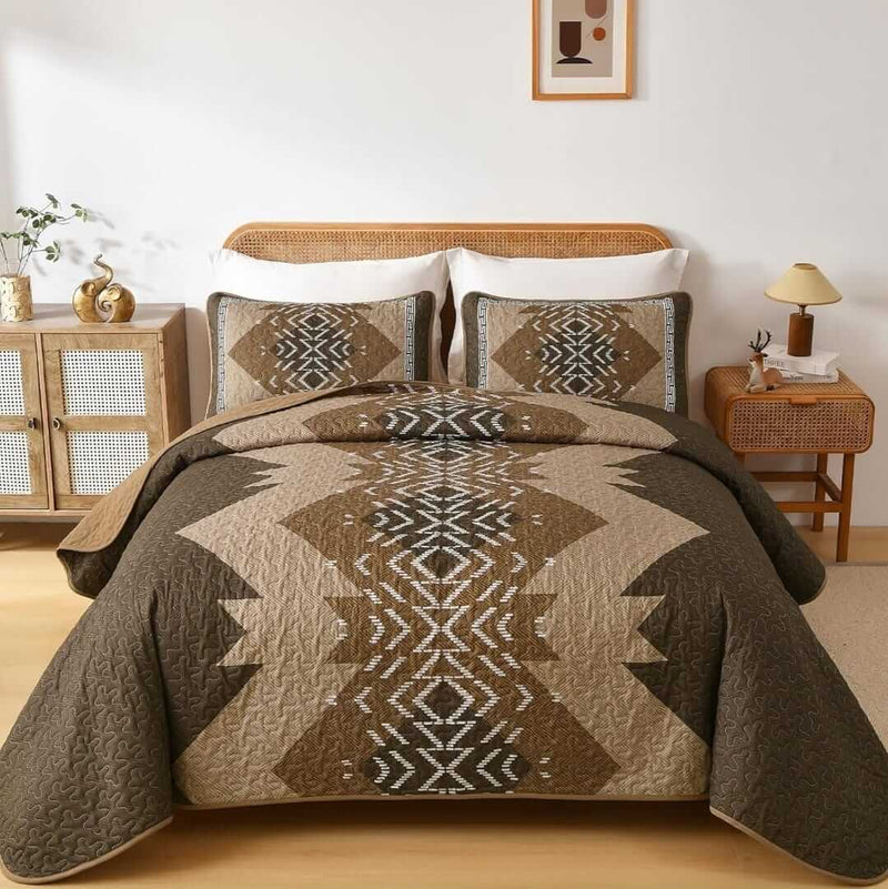 Patchwork quilt set on a bed in a bedroom with a wooden headboard.