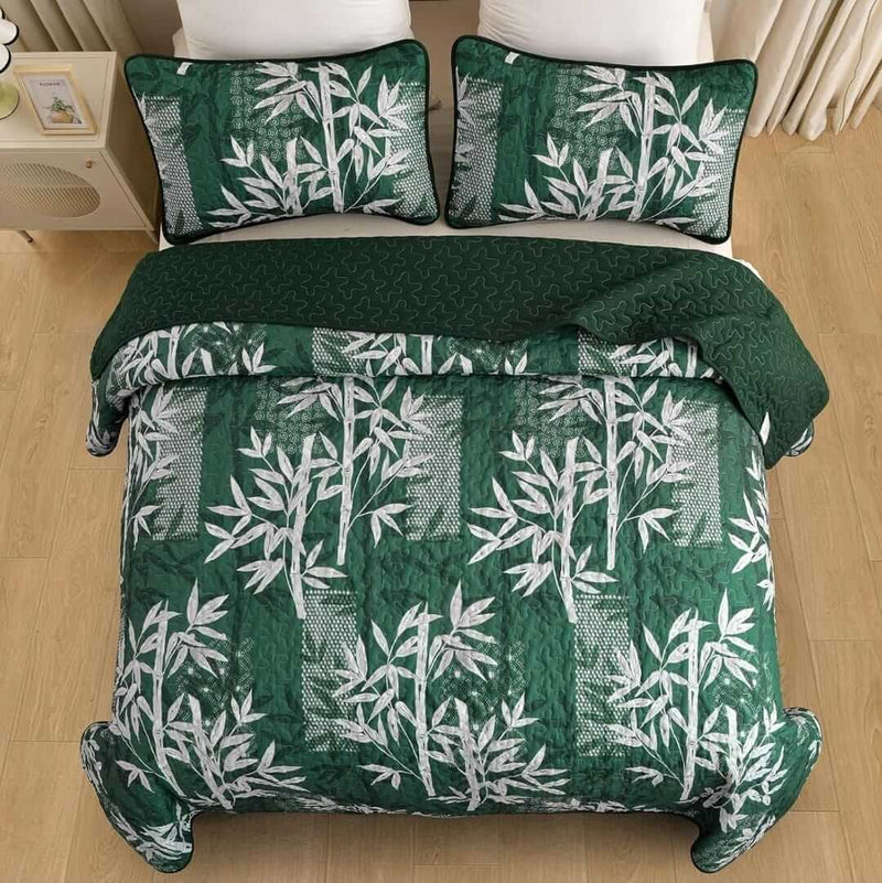 Bed with a colorful quilt and pillows in a bedroom setting.