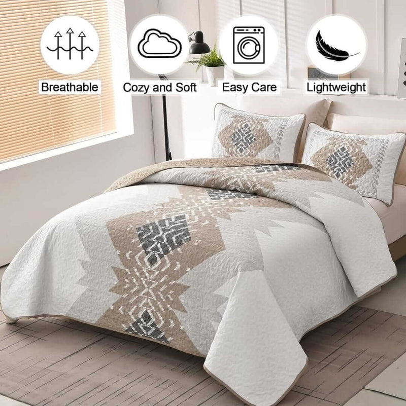 Bed with patterned quilt and pillows in a bedroom setting