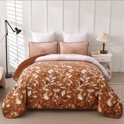 Bed with floral-patterned comforter in a bedroom setting